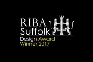 RIBA Suffolk Design Award Winner 2017 logo graces a black background, reflecting the elegance of ultra slim sliding doors.