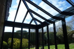 Hipped glass roof with bifold doors below