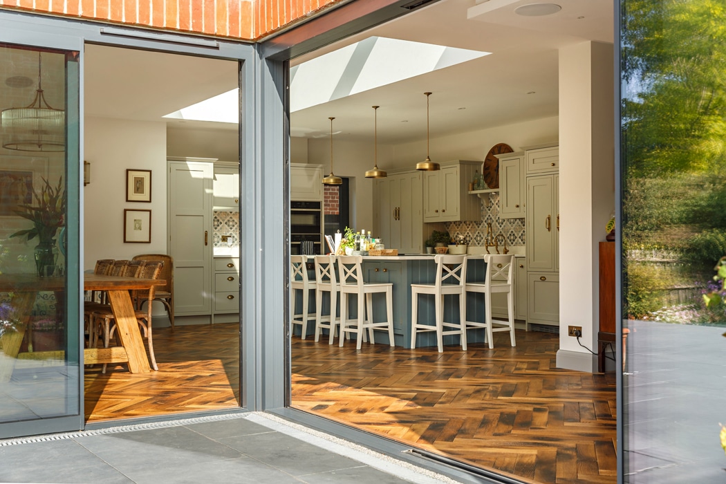 Large open plan kitchen extension with sliding doors