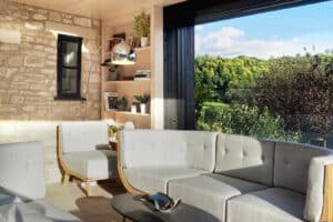 A modern living room features gray sofas, a wooden bookshelf, and a large window with sliding aluminum doors overlooking a green landscape. A chrome floor lamp and decorative items add a touch of elegance.