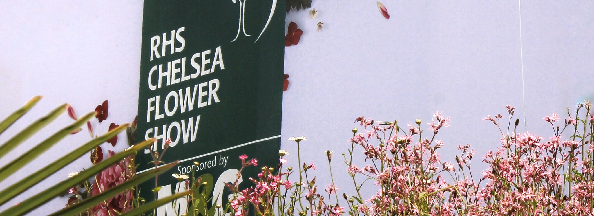 RHS Chelsea Flower Show logo on side of show pavillion