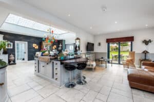 The large open-plan kitchen complete with SF55 French doors to the garden