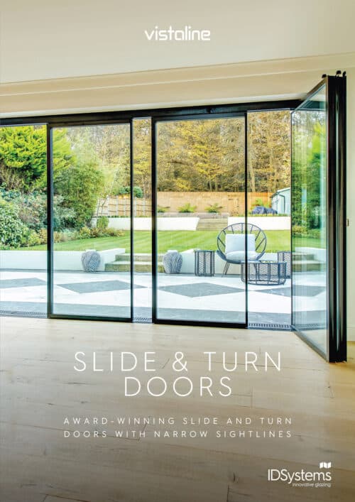 Spacious room with expansive glass slide and turn doors, offering seamless access to a lush garden area. Text reads "Slide & Turn Doors," showcasing award-winning designs with narrow sightlines, complemented by easy-to-access downloads for further inspiration.