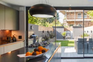 Modern open plan kitchen extension in Hackney with theEDGE2.0 sliding doors