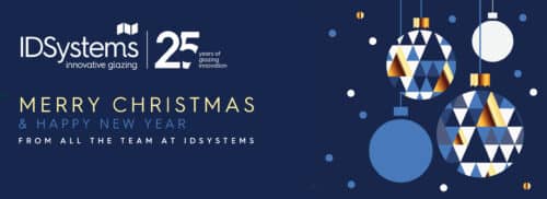 Festive holiday greeting card with geometric ornaments, celebrating 25 years of IDSystems, an innovative glazing company. Message reads: "Merry Christmas & Happy New Year from all the team at IDSystems.