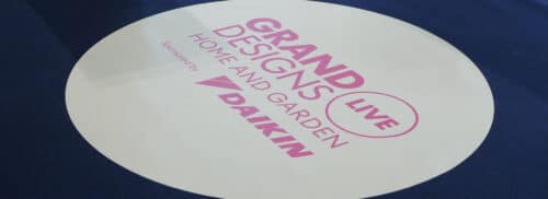 Grand Designs Live exhibition stand featuring IDSystems branding, showcasing glazing solutions and bifold doors for residential extensions and renovations.