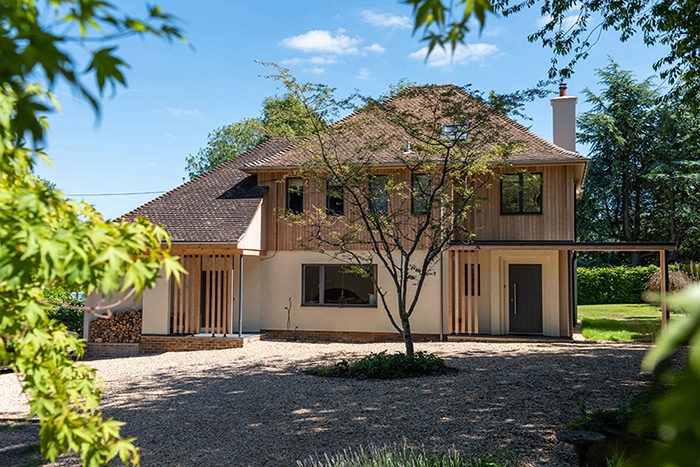 Modern Wiltshire home renovation featuring double-height glazing and contemporary architectural design with glazed extensions.